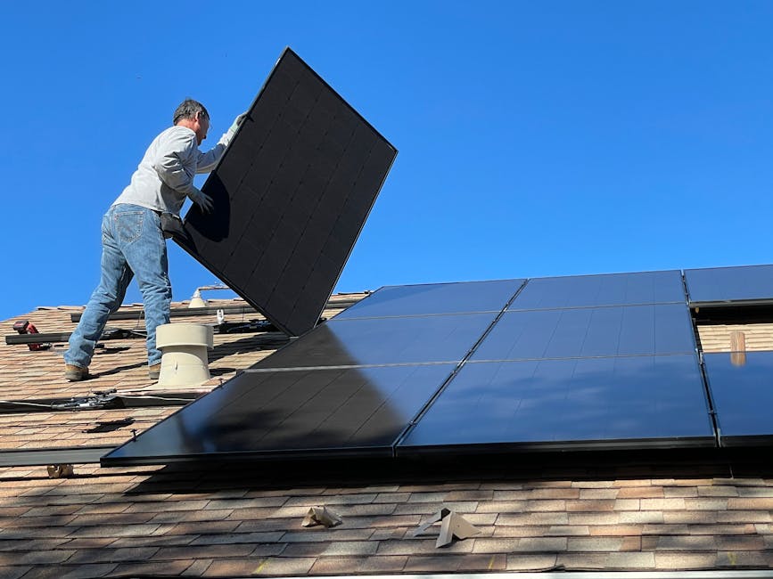 Solar technician on roof inspecting and maintaining solar panels - regular cleaning improves output