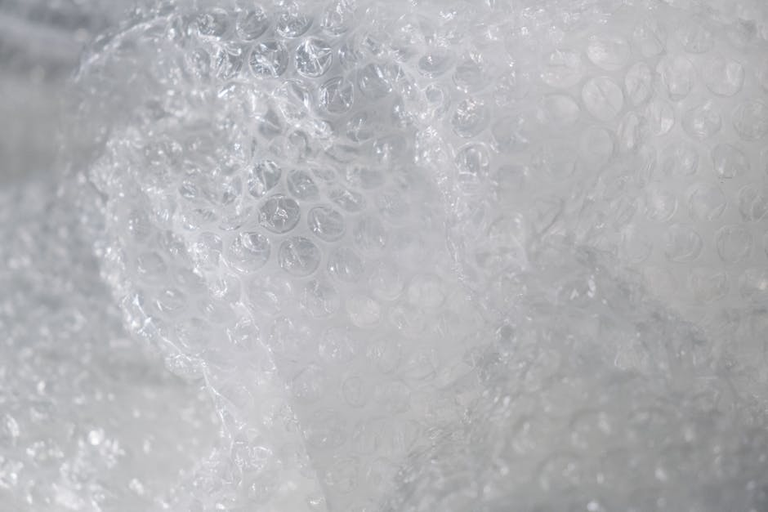 Close-up of bubble wrap texture showing large air-filled bubbles - best size for window insulation