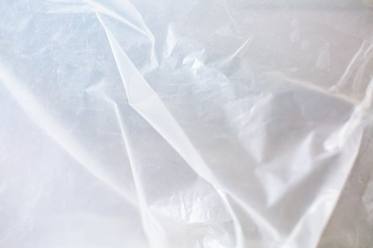 Transparent plastic sheeting for DIY window insulation - comparing bubble wrap vs plastic film methods