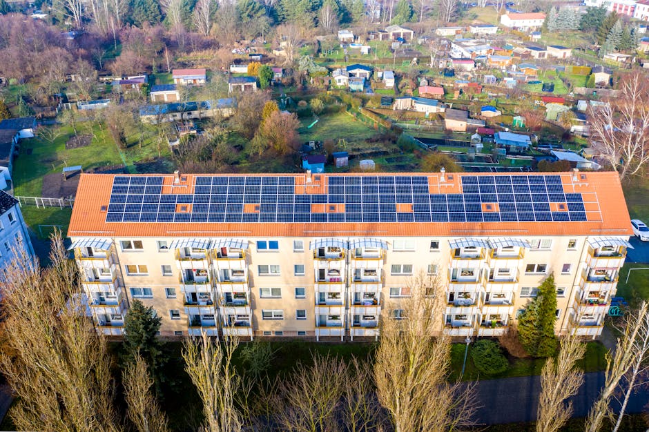 Aerial view of apartment complex with solar panels — every south or west-facing balcony has similar potential for plug-in solar savings