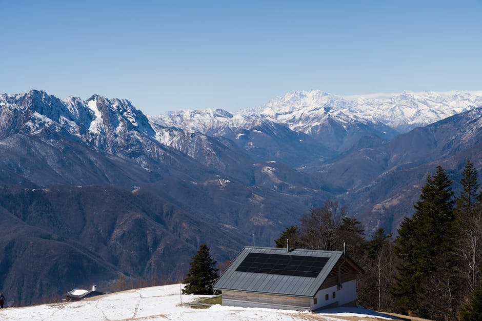 Solar-powered alpine cabin in winter snow — a correctly sized solar heating system keeps a cabin warm year-round without grid electricity or propane