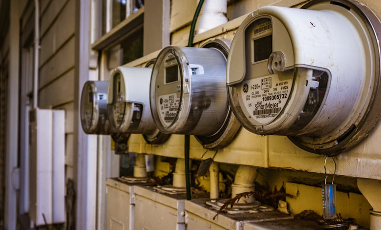 Smart electricity meters on a residential wall — understanding what drives your electricity bill is the first step to reducing it permanently